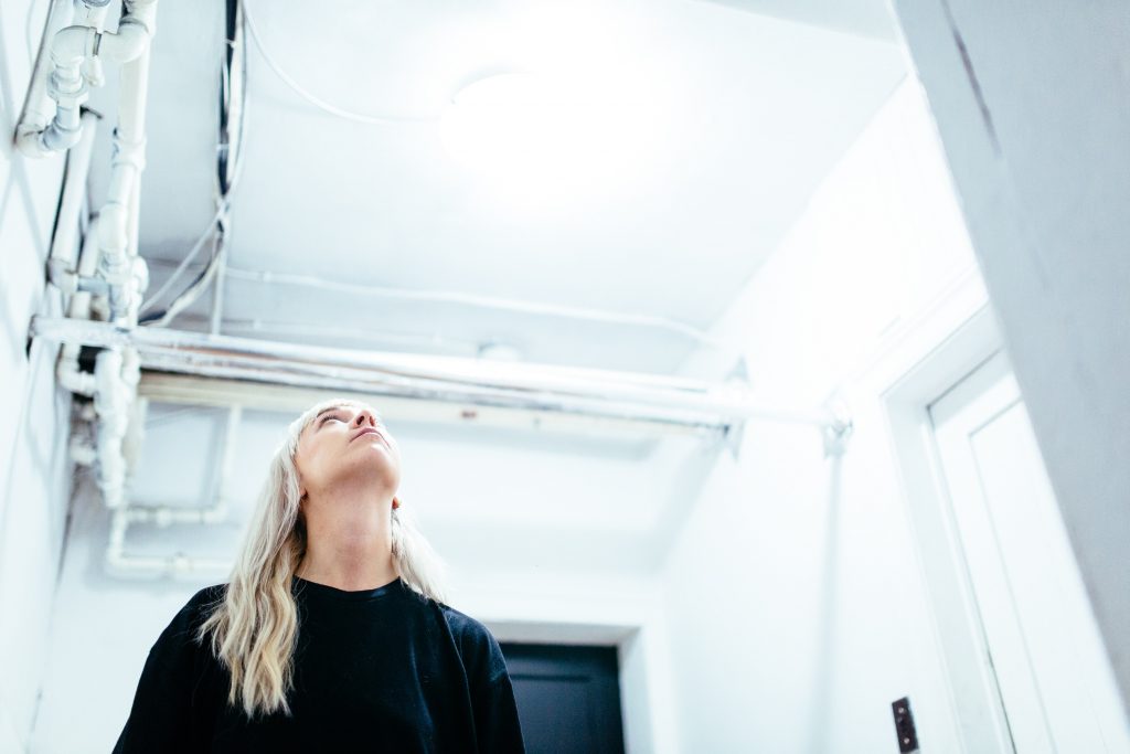 A woman appreciating a building that uses basic cad file management services