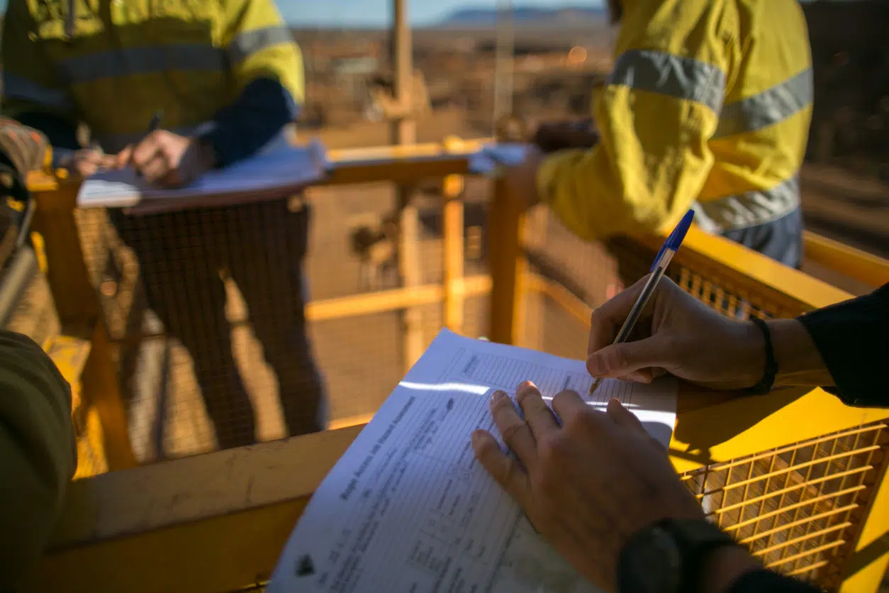 Auditing buildings process - Team of consultants checking a building's safety compliance.